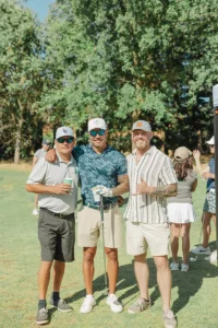 Three golfers enjoying the Copper for Kids Annual Golf Tournament hosted by Iron Mechanical.