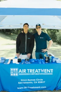 Air Treatment Corporation representatives at Iron Mechanical’s Copper for Kids Annual Golf Tournament sponsor booth.