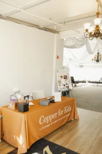 Copper for Kids charity raffle table set up at Iron Mechanical’s Annual Golf Tournament.