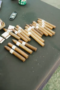 Premium cigars arranged on a table at Iron Mechanical’s Copper for Kids Annual Golf Tournament charity event.