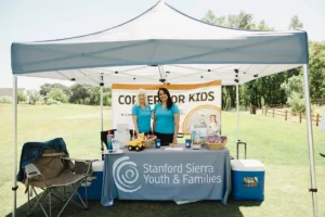 Stanford Sierra Youth & Families booth promoting the Copper for Kids campaign at Iron Mechanical’s Annual Golf Tournament.
