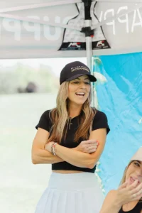 Smiling participant enjoying the Copper for Kids Annual Golf Tournament hosted by Iron Mechanical.