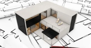 3D architectural rendering of a modern, two‑story modular building design placed on top of detailed floor plan drawings, representing precision engineering in CALGreen‑compliant construction.